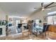 Spacious living and dining area with high ceilings, fireplace, and backyard access at 3816 Sunking St, Las Vegas, NV 89130