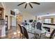 Open floor plan showcases a dining area next to a living room with fireplace and large TV at 3816 Sunking St, Las Vegas, NV 89130