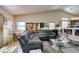 Bright living room with natural light, a comfortable sofa, and seamless flow to the dining area at 3816 Sunking St, Las Vegas, NV 89130