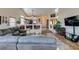 Open-concept living room with seamless flow to the kitchen and dining areas at 3816 Sunking St, Las Vegas, NV 89130