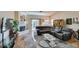Cozy living room featuring a corner sofa, fireplace, and seamless access to outdoor relaxation at 3816 Sunking St, Las Vegas, NV 89130