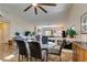 A modern dining table connects living spaces, with a fireplace adding warmth to the gathering area at 3816 Sunking St, Las Vegas, NV 89130