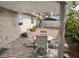Covered patio with outdoor dining set, overlooking a landscaped backyard at 3816 Sunking St, Las Vegas, NV 89130