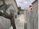 Side yard features a storage shed, a block wall, and a concrete pathway at 3816 Sunking St, Las Vegas, NV 89130