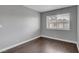 Bedroom featuring hardwood floors and a window at 4339 Spencer St # 15, Las Vegas, NV 89119