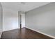 A light and airy bedroom with dark wood floors and a closet at 4339 Spencer St # 15, Las Vegas, NV 89119
