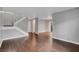Spacious living room showcasing hardwood floors, a staircase, and a neutral color palette at 4339 Spencer St # 15, Las Vegas, NV 89119