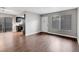 Inviting living area with wood flooring, leading to the kitchen and featuring ample natural light at 4339 Spencer St # 15, Las Vegas, NV 89119