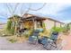 The home has an outdoor seating area on a raised wood platform next to the rock landscaping at 5741 N Park St, Las Vegas, NV 89149