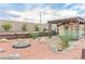 Cozy backyard with a charming guest house, fire pit, and ample seating provides the perfect outdoor retreat at 5741 N Park St, Las Vegas, NV 89149