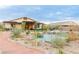 Lush backyard with rockscapes and pond, creating a tranquil outdoor living experience at 5741 N Park St, Las Vegas, NV 89149