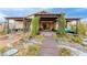 Backyard features a covered patio, custom landscaping, rock accents, and inviting walkways at 5741 N Park St, Las Vegas, NV 89149