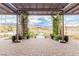 Backyard patio with pergola and lush landscaping offers mountain views and a serene retreat at 5741 N Park St, Las Vegas, NV 89149
