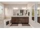 Bright bathroom with a double sink vanity, soaking tub, and ample counter space at 5741 N Park St, Las Vegas, NV 89149