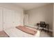 Cozy bedroom featuring wood floors, a closet, and a dedicated desk space at 5741 N Park St, Las Vegas, NV 89149