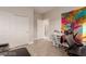 Well-lit bedroom features a desk area, a sliding closet, and access to another room at 5741 N Park St, Las Vegas, NV 89149