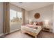 Bedroom featuring natural light, wood floor, and tastefully decorated interior at 5741 N Park St, Las Vegas, NV 89149