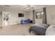 Spacious bedroom featuring modern flooring, ceiling fan, and ample natural light at 5741 N Park St, Las Vegas, NV 89149