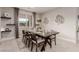 Bright dining room with a view, modern decor, and seating for a large Gathering at 5741 N Park St, Las Vegas, NV 89149