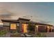 Attractive single-story home featuring a three-car garage and drought-tolerant desert landscaping at 5741 N Park St, Las Vegas, NV 89149