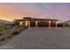 Charming single-story home featuring a three-car garage and desert-style front yard at 5741 N Park St, Las Vegas, NV 89149