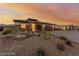 Inviting single-story home with desert landscaping, a three-car garage and a brick-paved driveway at 5741 N Park St, Las Vegas, NV 89149