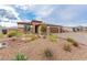 Charming single-story home featuring a three-car garage and desert-style front yard at 5741 N Park St, Las Vegas, NV 89149