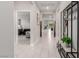 Bright hallway with a view into the living room and featuring modern decor and ceramic flooring at 5741 N Park St, Las Vegas, NV 89149