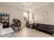 Spacious home office with two computer stations, comfortable seating, and neutral decor for a productive workspace at 5741 N Park St, Las Vegas, NV 89149