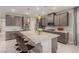 Modern kitchen with gray cabinetry, granite countertops, and stainless steel appliances at 5741 N Park St, Las Vegas, NV 89149
