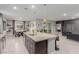 Kitchen with large island and great view to dining and living area at 5741 N Park St, Las Vegas, NV 89149