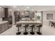 Modern kitchen with granite counters, stainless appliances, large island and seating at 5741 N Park St, Las Vegas, NV 89149