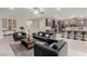 Spacious living room with open floor plan to kitchen and modern gray furniture at 5741 N Park St, Las Vegas, NV 89149