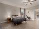 Bedroom featuring wood-look floors, neutral walls, and a comfortable lounge chair at 5741 N Park St, Las Vegas, NV 89149