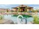 Backyard pond enhances this home's appeal, creating a tranquil outdoor living experience at 5741 N Park St, Las Vegas, NV 89149