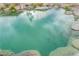Clear backyard pond showcases decorative koi fish and beautiful rock features at 5741 N Park St, Las Vegas, NV 89149