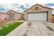 Charming home with low maintenance desert landscaping and a two-car garage at 6124 Desert Haven Rd, Las Vegas, NV 89130