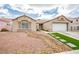 Charming home with low maintenance desert landscaping and a two-car garage at 6124 Desert Haven Rd, Las Vegas, NV 89130