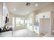 The kitchen features white cabinets, stone countertops, stainless steel appliances, and large windows at 6124 Desert Haven Rd, Las Vegas, NV 89130