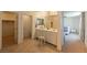 Bathroom boasts tile flooring, double sinks, and access to a walk-in closet and a bedroom at 6442 Kobe Knoll Ct, Las Vegas, NV 89141