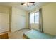 Bedroom with tile floor, window with curtains, closet and ceiling fan with light at 6442 Kobe Knoll Ct, Las Vegas, NV 89141