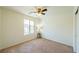 Bedroom with neutral carpet, standard closet and a window for natural light at 6442 Kobe Knoll Ct, Las Vegas, NV 89141