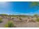 Scenic community park with walking trails, desert landscaping and seating areas, ideal for relaxation and recreation at 6442 Kobe Knoll Ct, Las Vegas, NV 89141