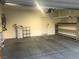 A well lit two-car garage showcasing organizational shelving and a clean, functional space for vehicles and storage at 6442 Kobe Knoll Ct, Las Vegas, NV 89141