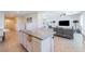 Spacious open concept kitchen and living room featuring a center island with seating at 6442 Kobe Knoll Ct, Las Vegas, NV 89141