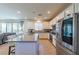 Open kitchen features granite countertops, stainless steel appliances, and seamless flow to the living area at 6442 Kobe Knoll Ct, Las Vegas, NV 89141