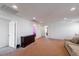 Spacious upstairs loft with carpet flooring, neutral paint, and a couch at 6442 Kobe Knoll Ct, Las Vegas, NV 89141