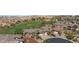 Great aerial view of neighborhood with golf course and mountain views in the background at 653 Paloma Cir, Mesquite, NV 89027