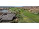 Aerial view highlighting backyard privacy, desert landscaping, and golf course views at 653 Paloma Cir, Mesquite, NV 89027