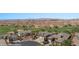 Wonderful aerial view of neighborhood with golf course and mountain views in the background at 653 Paloma Cir, Mesquite, NV 89027
